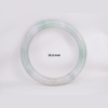 Natural Burmese jade bangle in thin donut shape. Genuine jade bracelet symbolizing protection, harmony, and prosperity. Elegant collectible jewelry gift.