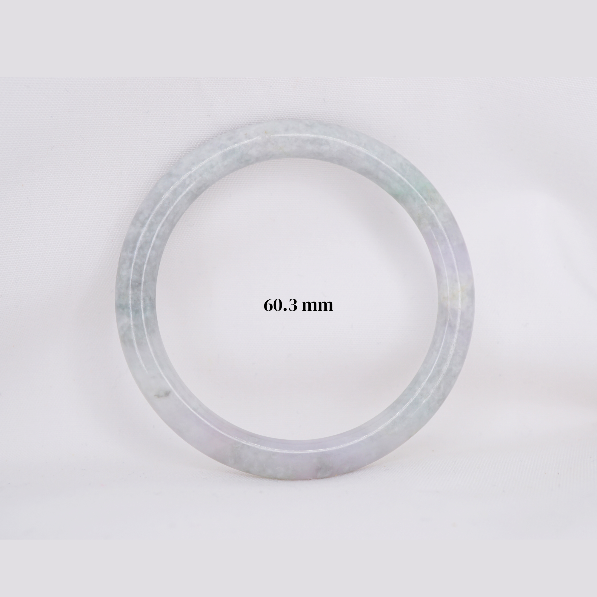 Natural Burmese jade bangle in thin donut shape. Genuine jade bracelet symbolizing protection, harmony, and prosperity. Elegant collectible jewelry gift.