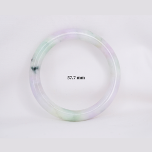 Natural Burmese jade bangle in thin donut shape. Genuine jade bracelet symbolizing protection, harmony, and prosperity. Elegant collectible jewelry gift.