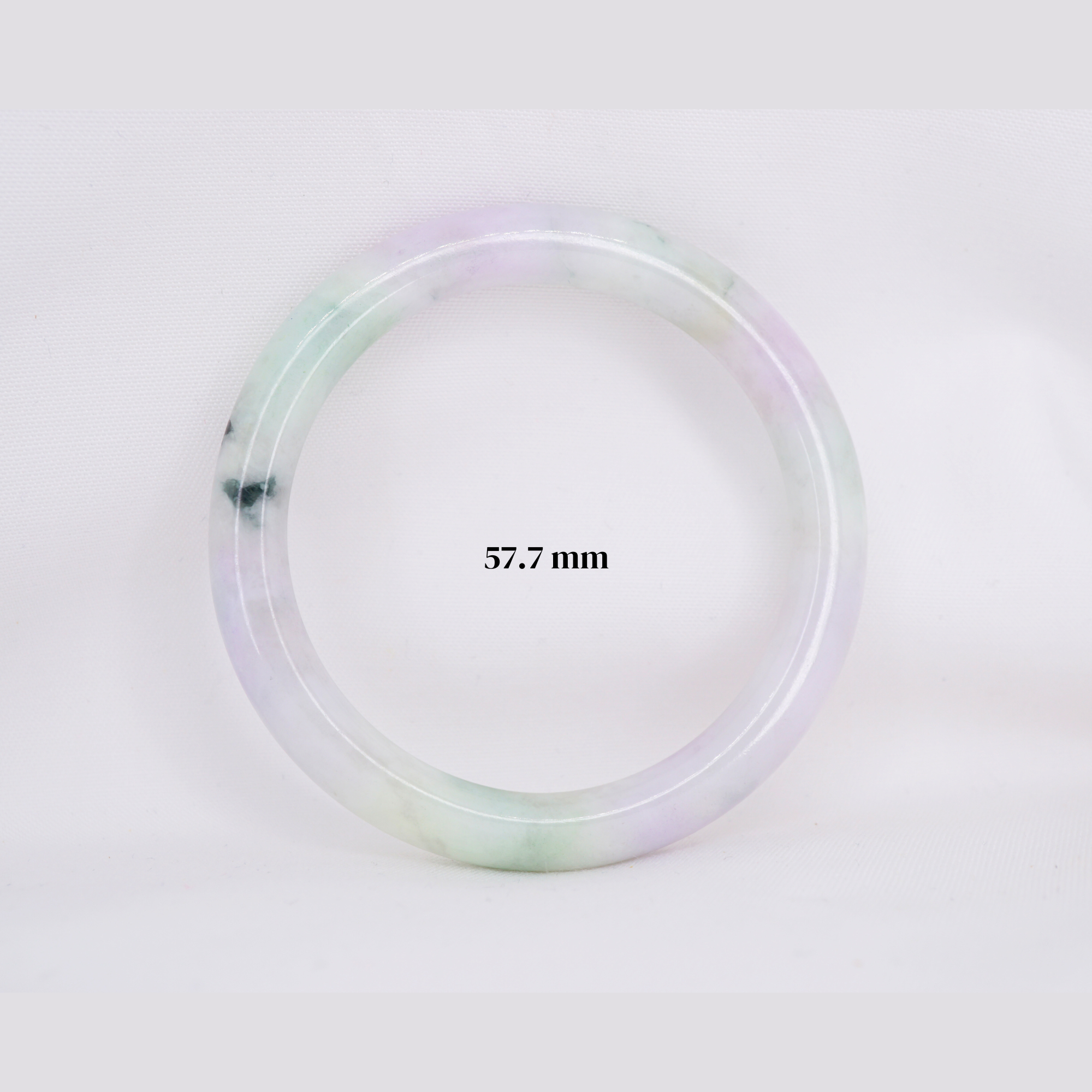 Natural Burmese jade bangle in thin donut shape. Genuine jade bracelet symbolizing protection, harmony, and prosperity. Elegant collectible jewelry gift.