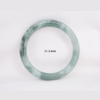 Natural Burmese jade bangle in thin donut shape. Genuine jade bracelet symbolizing protection, harmony, and prosperity. Elegant collectible jewelry gift.