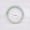 Natural Burmese jade bangle in thin donut shape. Genuine jade bracelet symbolizing protection, harmony, and prosperity. Elegant collectible jewelry gift.