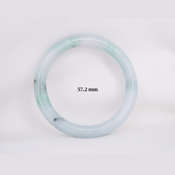 Natural Burmese jade bangle in thin donut shape. Genuine jade bracelet symbolizing protection, harmony, and prosperity. Elegant collectible jewelry gift.