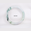 Natural Burmese jade bangle in thin donut shape. Genuine jade bracelet symbolizing protection, harmony, and prosperity. Elegant collectible jewelry gift.