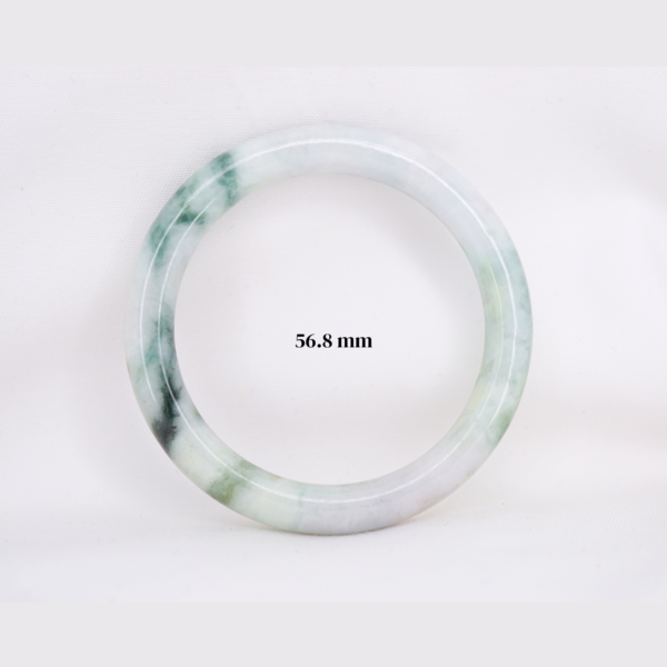 Natural Burmese jade bangle in thin donut shape. Genuine jade bracelet symbolizing protection, harmony, and prosperity. Elegant collectible jewelry gift.