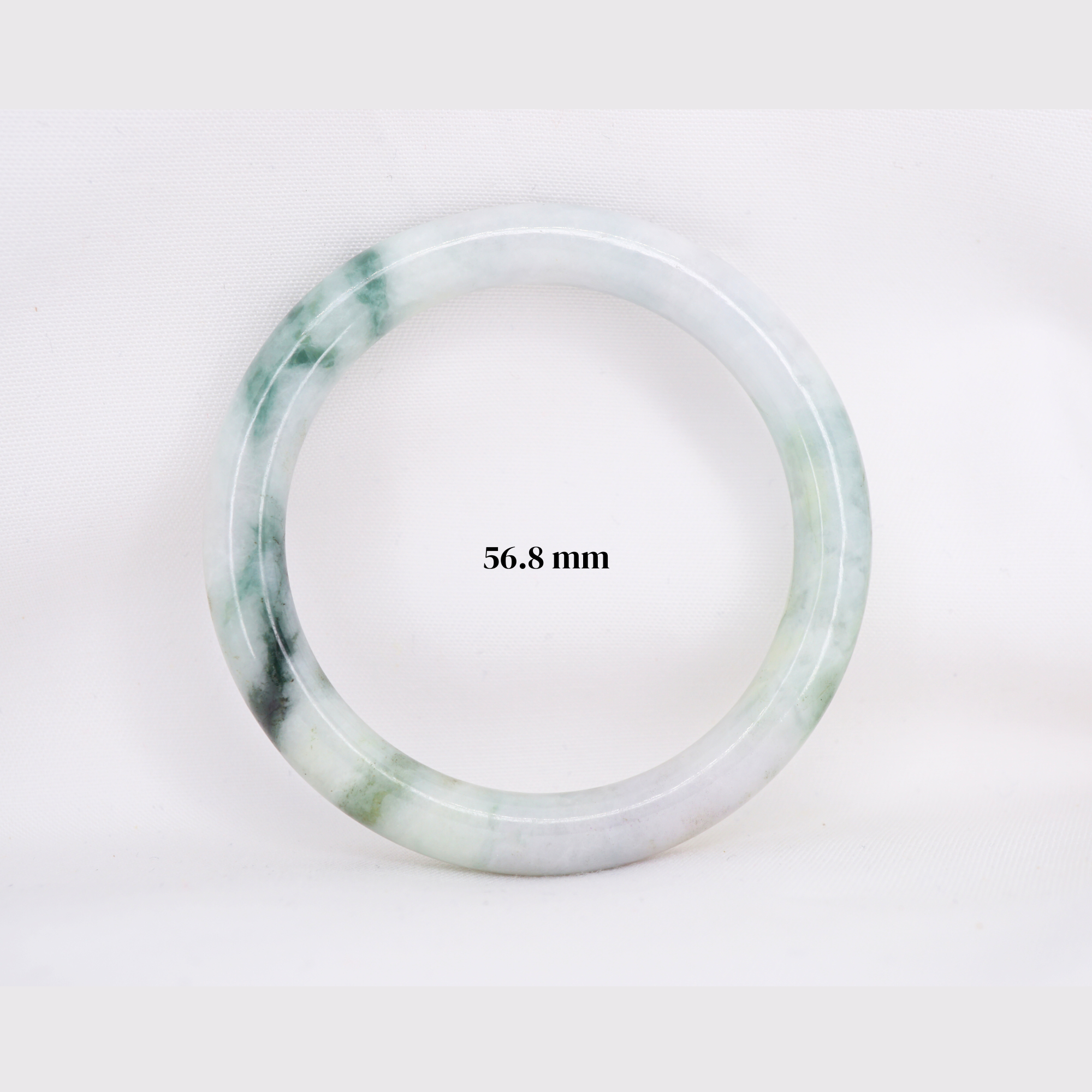 Natural Burmese jade bangle in thin donut shape. Genuine jade bracelet symbolizing protection, harmony, and prosperity. Elegant collectible jewelry gift.