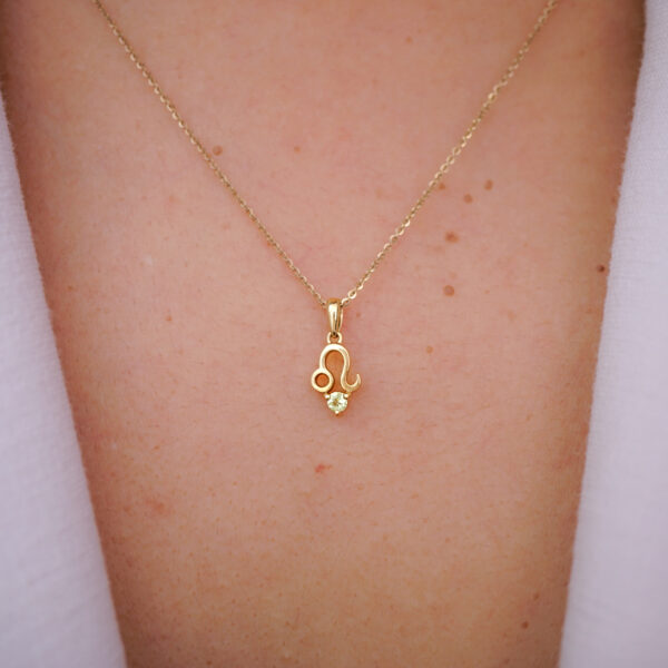 10K solid gold Leo pendant necklace with natural peridot. Genuine Au 417 zodiac jewelry symbolizing strength, confidence, and prosperity. Premium gift ready.