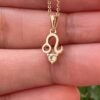 10K solid gold Leo pendant necklace with natural peridot. Genuine Au 417 zodiac jewelry symbolizing strength, confidence, and prosperity. Premium gift ready.